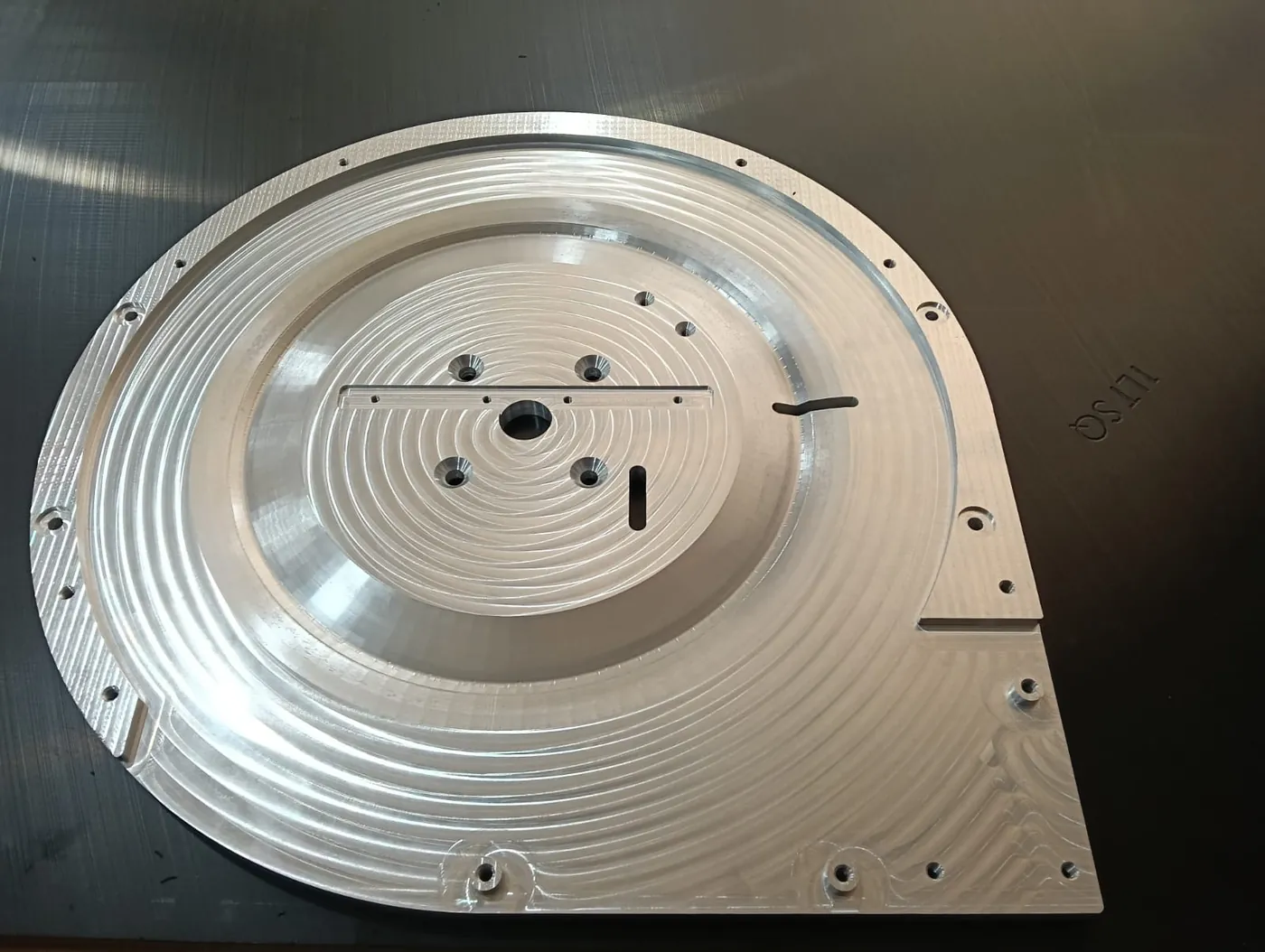 Large milled plate showing pocketing and drilled hole pattern