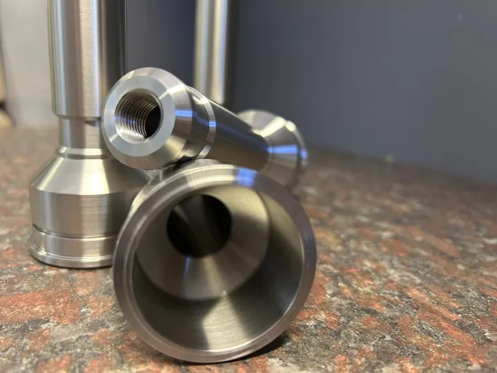 Turned stainless steel filler nozzles with threaded and flared ends